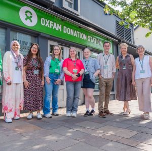 Group picture with staff and volunteers in front of the Oxfam Holywood superstore.