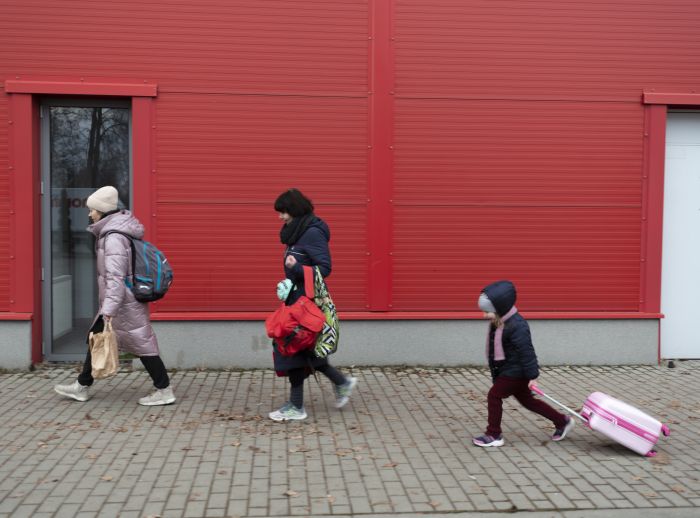 Julia, 44, her mother-in-law Leana, 58, her son Andrey*, 9, and nieces and nephews from Kharkiv at the Hallo Kijowska reception centre for refugees from Ukraine. Korczowa, Poland.