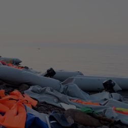 refugee dinghy boat washed off the coast